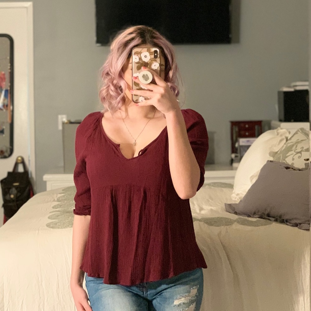 Woman’s maroon blouse
